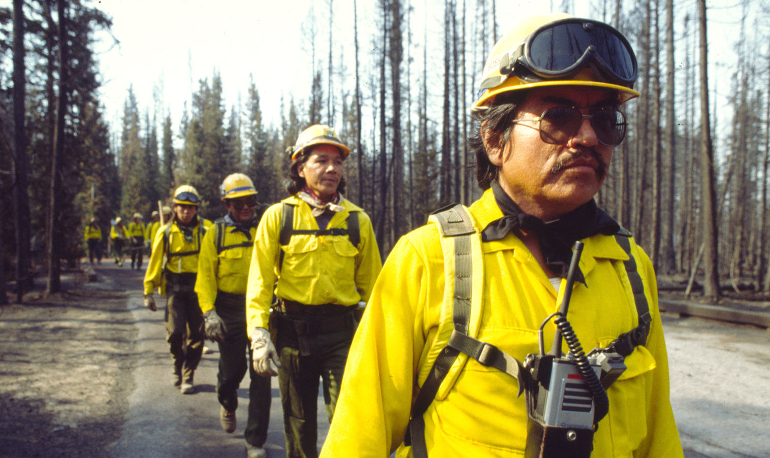 Crew boss Alfred Burson leads a march to the fire line